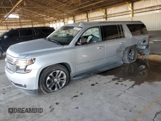 2018 Chevrolet Suburban Premier with VIN 1GNSCJKC7JR104888, listed as a Copart auction lot 68027604 with 69,632 mi miles and Salvage Title. Bid and sale history available at DreamBid. Image 1.