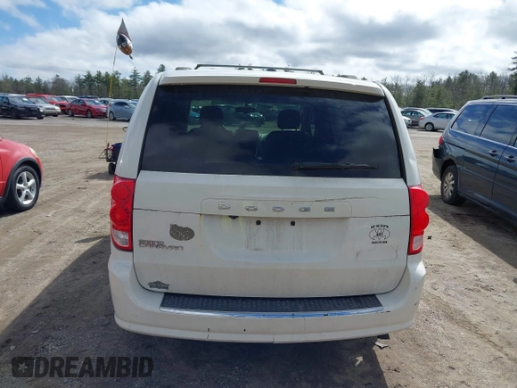 2012 Dodge Grand Caravan SXT with VIN 2C4RDGCGXCR248859, listed as a IAAI auction lot 41829411 with 111,515 mi miles and . Bid and sale history available at DreamBid. Image 13.
