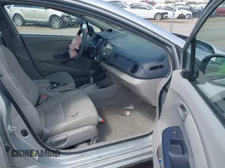 2010 Honda Insight EX with VIN JHMZE2H71AS017996, listed as a IAAI auction lot 42091356 with 142,474 mi miles and . Bid and sale history available at DreamBid. Image 5.