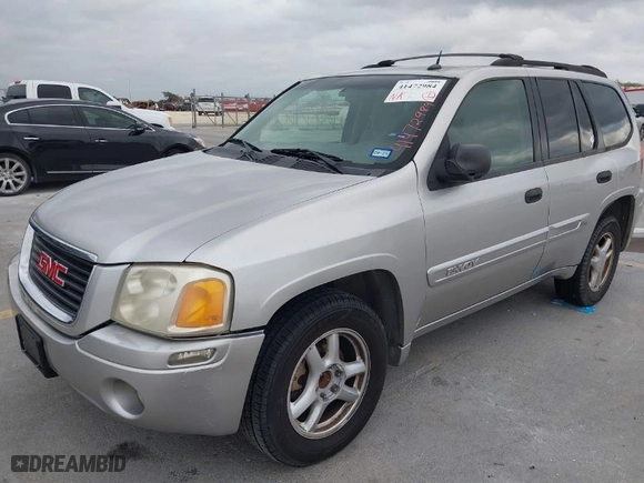 2004 GMC Envoy SLE with VIN 1GKDS13S642247715, listed as a IAAI auction lot 41472984 with 240,550 mi miles. Bid and sale history available at carsss.com. Image 2.