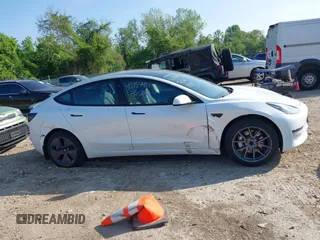 2023 Tesla Model 3 with VIN 5YJ3E1EA3PF617460, listed as a IAAI auction lot 42154401 with 9,578 mi miles and . Bid and sale history available at DreamBid. Image 12.
