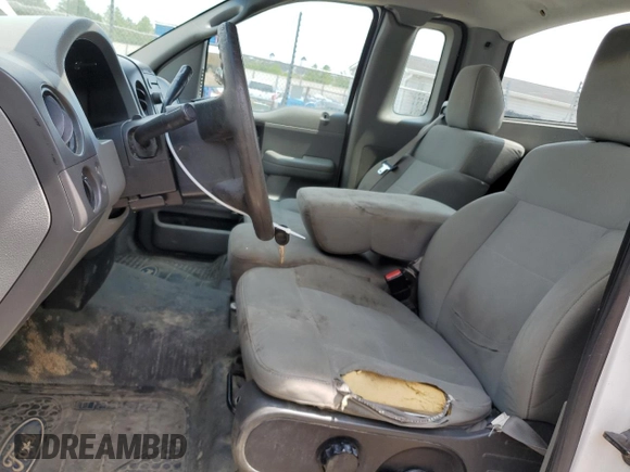 2007 Ford F-150 XL with VIN 1FTRF122X7NA00997, listed as a Copart auction lot 59664585 with 295,172 mi miles and Salvage title. Bid and sale history available at DreamBid. Image 7.