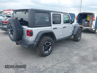 2024 Jeep Wrangler Rubicon with VIN 1C4RJXR61RW224506, listed as a IAAI auction lot 42111434 with 33,689 mi miles and . Bid and sale history available at DreamBid. Image 4.