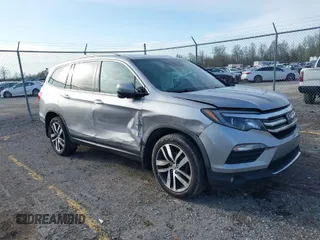 2016 Honda Pilot Touring with VIN 5FNYF6H90GB024902, listed as a IAAI auction lot 41948563 with 148,598 mi miles. Bid and sale history available at carsss.com. Image 1.