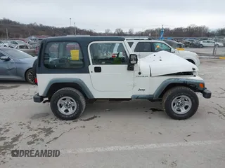 1998 Jeep Wrangler SE with VIN 1J4FY29P9WP793260, listed as a IAAI auction lot 41596990 with 90,766 mi miles. Bid and sale history available at carsss.com. Image 13.