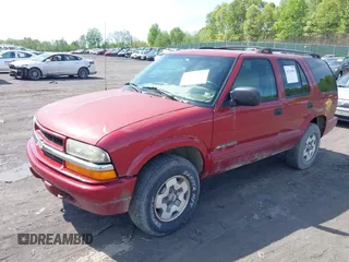 2002 Chevrolet Blazer LS z VIN 1GNDT13WX2K237284, wystawiony jako IAAI lot #42193499 z przebiegiem 137 258 mil mil oraz . Historia ofert i sprzedaży dostępna na DreamBid. Obrazek 2.