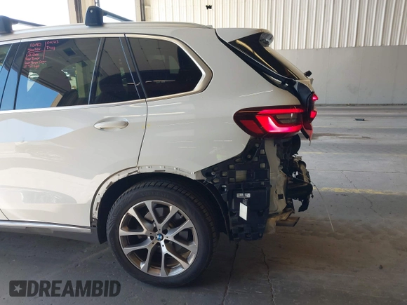2022 BMW X5 xDrive40i with VIN 5UXCR6C09N9M21945, listed as a IAAI auction lot 42170363 with 23,537 mi miles and . Bid and sale history available at DreamBid. Image 6.