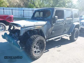 2011 Jeep Wrangler Unlimited Rubicon with VIN 1J4BA6H16BL615945, listed as a IAAI auction lot 42159418 with Not provided miles and . Bid and sale history available at DreamBid. Image 2.