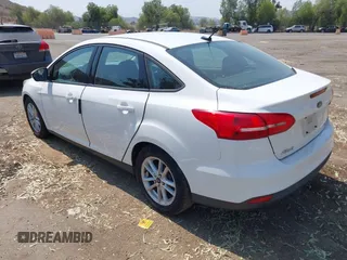 2016 Ford Focus SE z VIN 1FADP3F24GL268619, wystawiony jako IAAI lot #42750298 z przebiegiem 96 587 mil mil oraz . Historia ofert i sprzedaży dostępna na DreamBid. Obrazek 3.