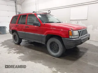 1996 Jeep Grand Cherokee Laredo z VIN 1J4GZ58S1TC348393, wystawiony jako IAAI lot #42677548 z przebiegiem 275 707 mil mil oraz . Historia ofert i sprzedaży dostępna na DreamBid. Obrazek 1.