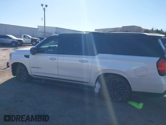 2021 GMC Yukon XL Denali with VIN 1GKS2JKT1MR401207, listed as a IAAI auction lot 41242619 with 87,902 mi miles and . Bid and sale history available at carsss.com. Image 14.