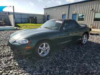 2001 Mazda MX-5 Miata with VIN JM1NB353010218946, listed as a Copart auction lot 64693255 with 76,945 mi miles and Salvage title. Bid and sale history available at DreamBid. Image 1.