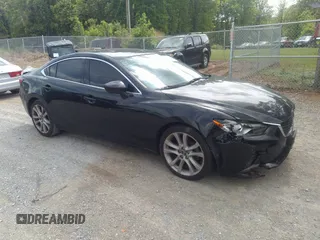 2015 Mazda 6 i Grand Touring with VIN JM1GJ1W68F1168078, listed as a IAAI auction lot 42149519 with 127,641 mi miles and . Bid and sale history available at DreamBid. Image 1.