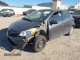2013 Toyota Yaris L with VIN JTDKTUD39DD543776, listed as a IAAI auction lot 41758128 with 228,595 mi miles. Bid and sale history available at carsss.com. Image 2.