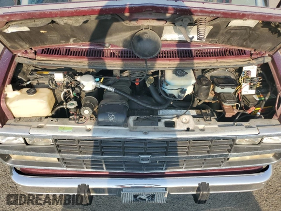 1993 Chevrolet Chevy Van z VIN 1GBEG25K8PF357638, wystawiony jako Copart lot #69878944 z przebiegiem 170 004 mil mil oraz Szkoda całkowita • Salvage title. Historia ofert i sprzedaży dostępna na DreamBid. Obrazek 12.