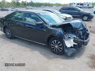 2014 Toyota Camry L with VIN 4T4BF1FKXER402857, listed as a IAAI auction lot 42144757 with 192,081 mi miles and . Bid and sale history available at DreamBid. Image 1.