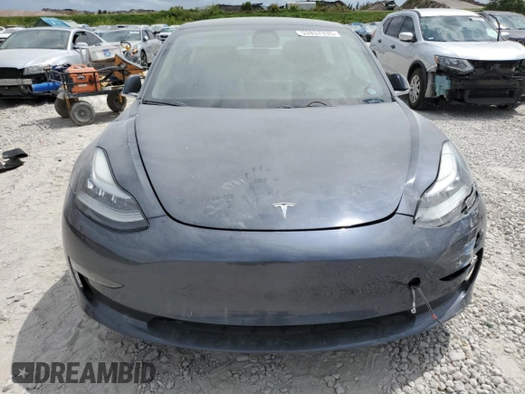 2019 Tesla Model 3 Mid Range z VIN 5YJ3E1EA4KF434741, wystawiony jako Copart lot #53857935 z przebiegiem Nie podano mil oraz Szkody całkowita. Historia ofert i sprzedaży dostępna na DreamBid. Obrazek 5.
