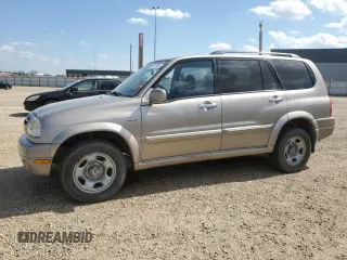 2001 Suzuki XL7 Standard z VIN JS3TX92V014109351, wystawiony jako Copart lot #66721605 z przebiegiem 232 646 mil mil oraz Szkoda całkowita • Salvage title. Historia ofert i sprzedaży dostępna na DreamBid. Obrazek 1.