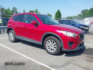 2016 Mazda CX-5 Touring z VIN JM3KE2CYXG0618273, wystawiony jako IAAI lot #42152997 z przebiegiem 146 876 mil mil oraz . Historia ofert i sprzedaży dostępna na DreamBid. Obrazek 1.