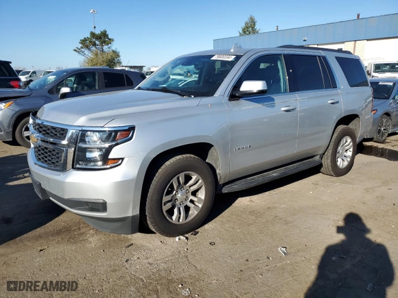 2020 Chevrolet Tahoe LT with VIN 1GNSKBKCXLR157872, listed as a Copart auction lot 79806594 with 129,729 mi miles and Salvage Title. Bid and sale history available at carsss.com. Image 1.