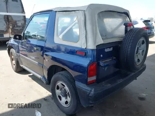 1997 Chevrolet Tracker z VIN 2CNBE1865V6926154, wystawiony jako IAAI lot #42207157 z przebiegiem 176 104 mil mil oraz . Historia ofert i sprzedaży dostępna na DreamBid. Obrazek 3.