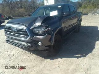 2018 Toyota Tacoma SR5 with VIN 5TFAZ5CN0JX056706, listed as a IAAI auction lot 41774141 with 31,738 mi miles and . Bid and sale history available at DreamBid. Image 6.