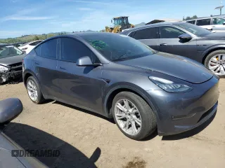 2022 Tesla Model Y Long Range with VIN 7SAYGDEE2NF402320, listed as a Copart auction lot 50396605 with 27,426 mi miles and Salvage Title. Bid and sale history available at DreamBid. Image 4.