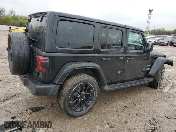 2023 Jeep Wrangler Sahara z VIN 1C4JJXP62PW514489, wystawiony jako Copart lot #51811585 z przebiegiem 39 174 mil mil oraz Szkoda całkowita • Salvage title. Historia ofert i sprzedaży dostępna na DreamBid. Obrazek 3.