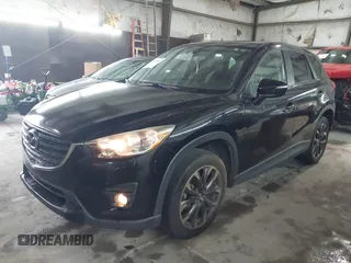 2016 Mazda CX-5 Grand Touring with VIN JM3KE4DY5G0816575, listed as a IAAI auction lot 42101340 with 180,762 mi miles and . Bid and sale history available at carsss.com. Image 2.