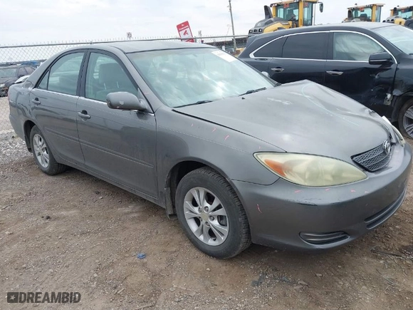 2004 Toyota Camry LE with VIN 4T1BF32KX4U575854, listed as a IAAI auction lot 41690613 with 264,186 mi miles. Bid and sale history available at carsss.com. Image 1.