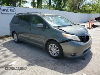 2014 Toyota Sienna XLE with VIN 5TDYK3DC1ES453924, listed as a Copart auction lot 56148565 with 198,185 mi miles and Clean title. Bid and sale history available at DreamBid. Image 4.