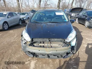 2014 Ford Fiesta Titanium z VIN 3FADP4FJXEM127644, wystawiony jako IAAI lot #41555040 z przebiegiem 107 046 mil mil oraz . Historia ofert i sprzedaży dostępna na DreamBid. Obrazek 13.