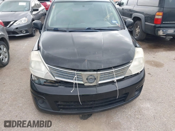 2009 Nissan Versa 1.8 SL with VIN 3N1BC13E59L496882, listed as a IAAI auction lot 41798734 with 210,907 mi miles. Bid and sale history available at carsss.com. Image 12.