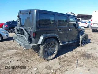 2015 Jeep Wrangler Unlimited Rubicon with VIN 1C4BJWFG9FL755152, listed as a IAAI auction lot 41293766 with 109,153 mi miles. Bid and sale history available at carsss.com. Image 4.
