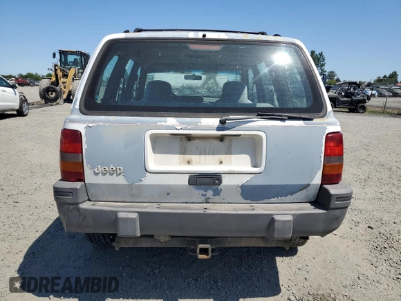 1993 Jeep Grand Cherokee Laredo с VIN 1J4GZ58S2PC654248, выставлен на аукционе Copart как лот 61259735 с пробегом 251 360 миль миль и Списание • Salvage title. История ставок и продаж доступна на DreamBid. Изображение 6.