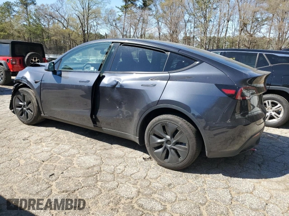 2024 Tesla Model Y Long Range z VIN 7SAYGDEE3RA323029, wystawiony jako Copart lot #50171805 z przebiegiem Nie podano mil oraz Szkoda całkowita • Salvage title. Historia ofert i sprzedaży dostępna na DreamBid. Obrazek 2.