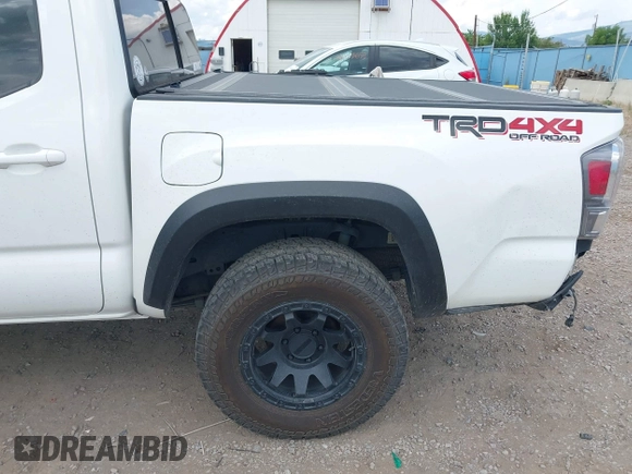 2022 Toyota Tacoma SR with VIN 3TMCZ5AN1NM478457, listed as a IAAI auction lot 42479107 with 59,547 mi miles and . Bid and sale history available at DreamBid. Image 18.