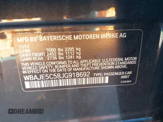 2018 BMW 5 Series 540i with VIN WBAJE5C58JG918692, listed as a IAAI auction lot 41665415 with 61,261 mi miles and . Bid and sale history available at carsss.com. Image 9.