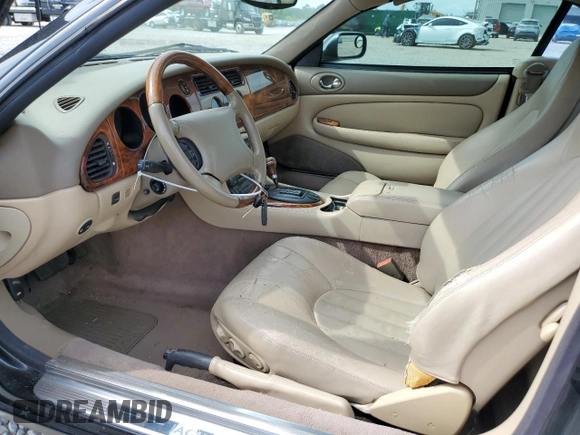 1999 Jaguar XK z VIN SAJGX2044XC031383, wystawiony jako Copart lot #54726925 z przebiegiem 107 696 mil mil oraz Szkody całkowita. Historia ofert i sprzedaży dostępna na DreamBid. Obrazek 7.