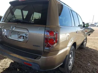 2008 Honda Pilot EX-L with VIN 5FNYF18758B052858, listed as a IAAI auction lot 41414168 with 157,060 mi miles. Bid and sale history available at carsss.com. Image 4.
