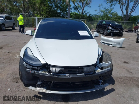 2022 Tesla Model 3 Long Range z VIN 5YJ3E1EB4NF163001, wystawiony jako IAAI lot #42211705 z przebiegiem 53 487 mil mil oraz . Historia ofert i sprzedaży dostępna na DreamBid. Obrazek 13.
