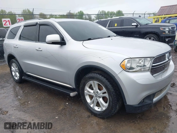 2012 Dodge Durango Crew with VIN 1C4RDJDG0CC322388, listed as a IAAI auction lot 42179814 with 124,009 mi miles and . Bid and sale history available at carsss.com. Image 1.