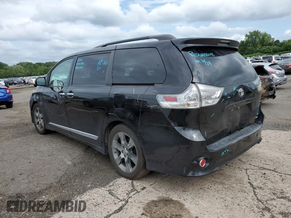 2014 Toyota Sienna SE with VIN 5TDXK3DC7ES425945, listed as a Copart auction lot 63067955 with 173,815 mi miles and Salvage title. Bid and sale history available at DreamBid. Image 2.