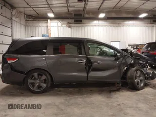 2021 Honda Odyssey Touring with VIN 5FNRL6H82MB025923, listed as a IAAI auction lot 42104290 with 61,178 mi miles and . Bid and sale history available at DreamBid. Image 14.