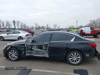 2015 Infiniti Q50 z VIN JN1BV7AR6FM412573, wystawiony jako IAAI lot #41796802 z przebiegiem 136 410 mil mil oraz . Historia ofert i sprzedaży dostępna na DreamBid. Obrazek 14.