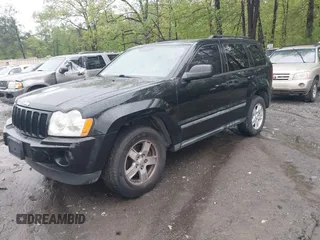 2007 Jeep Grand Cherokee Laredo with VIN 1J8GS48K57C516037, listed as a IAAI auction lot 41982692 with 273,961 mi miles. Bid and sale history available at carsss.com. Image 2.