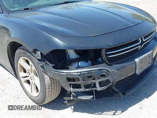 2015 Dodge Charger SE with VIN 2C3CDXBG9FH790573, listed as a IAAI auction lot 42142908 with 195,182 mi miles and . Bid and sale history available at carsss.com. Image 19.