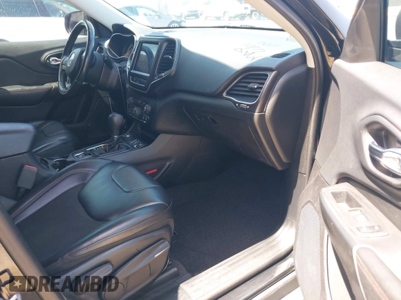 2019 Jeep Cherokee Trailhawk Elite with VIN 1C4PJMBX0KD198328, listed as a IAAI auction lot 42085194 with 76,312 mi miles and . Bid and sale history available at DreamBid. Image 5.