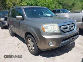 2011 Honda Pilot Touring with VIN 5FNYF4H94BB021952, listed as a IAAI auction lot 41985940 with 170,043 mi miles. Bid and sale history available at carsss.com. Image 1.