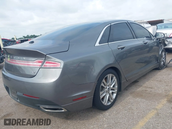 2014 Lincoln MKZ z VIN 3LN6L2GK3ER807586, wystawiony jako IAAI lot #42426125 z przebiegiem 198 281 mil mil oraz . Historia ofert i sprzedaży dostępna na DreamBid. Obrazek 4.